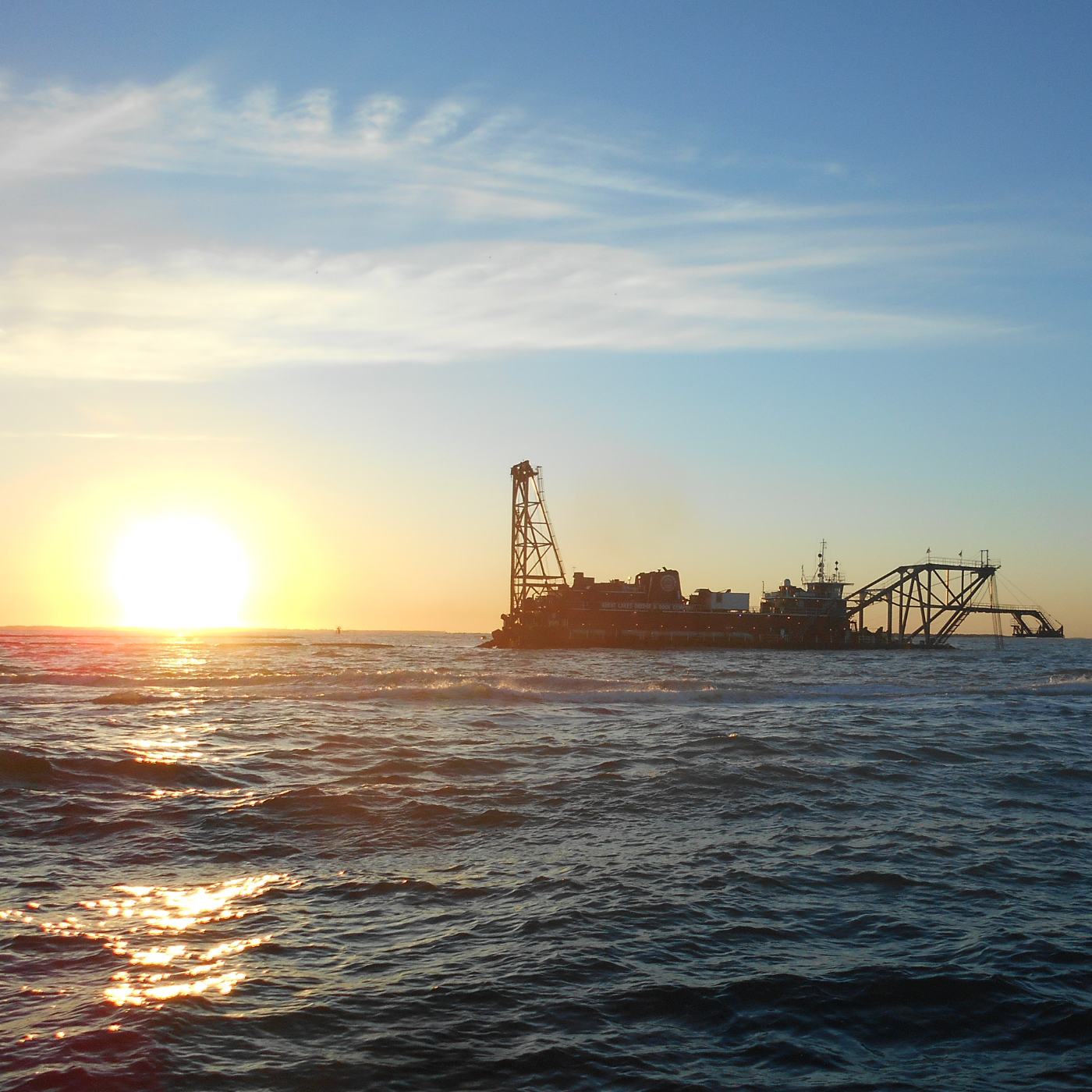 Dredge operating on water.