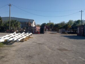 Industrial area with truck in background.