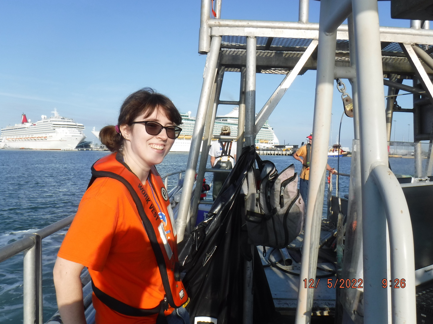 Field team members pictured in transit in front of cruise ships in Canaveral.