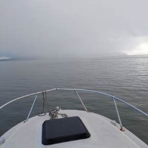 Field team working off the coast of Oregon with a hazy fog rolling in.